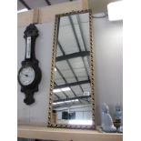 A gilt framed rectangular mirror