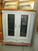 A fine grey painted display cabinet