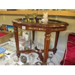 A glass topped occasional table