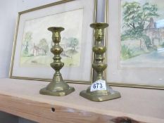 A pair of brass candlesticks