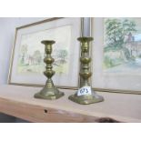 A pair of brass candlesticks