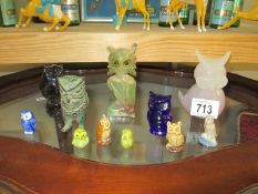 A quantity of small china and glass owls etc.