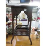 An ornate hall table/pot stand