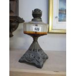 A cast oil lamp (no shade or chimney)