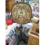 A Victorian mahogany pole screen on tripod base and with tapestry panel