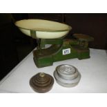 A set of old kitchen scales and weights