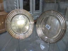 A pair of silver plated Christofle plates