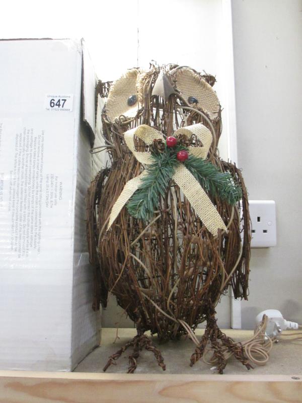 A boxed wicker owl model