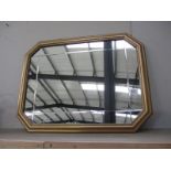A gilt framed 8 sided mirror