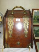 An old coal scuttle with brass features