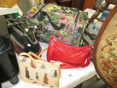 A ladies holdall and vanity case and 3 handbags