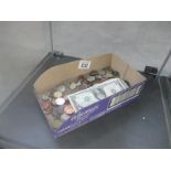 A box of foreign coins and banknotes