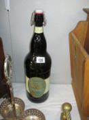 An oversize bottle of Cheddington Golden Ale