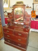 A vintage mirror backed dresser with 3 drawers