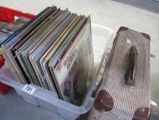 A box of LP records and an empty LP case