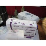 A Gemini Stitch machine (as new) and a box of sewing related items