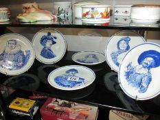 A complete set of 6 Delft blue plates depicting Jester, musketeers etc.