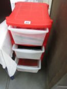 A quantity of craft items in a 4 drawer storage container