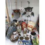 A collection of owl figurines,