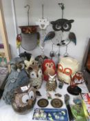 A collection of owl figurines,