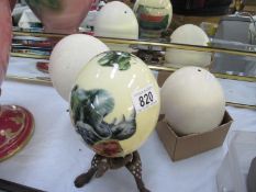 3 ostrich eggs, 2 on stands,