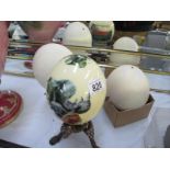 3 ostrich eggs, 2 on stands,