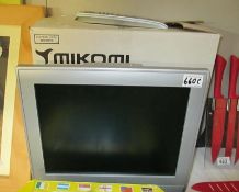 A boxed Mikon 15" TFT LCD TV with remote control