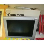 A boxed Mikon 15" TFT LCD TV with remote control