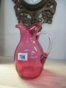 A cranberry glass vase