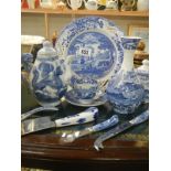 A collection of blue and white china and cutlery