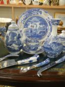 A collection of blue and white china and cutlery