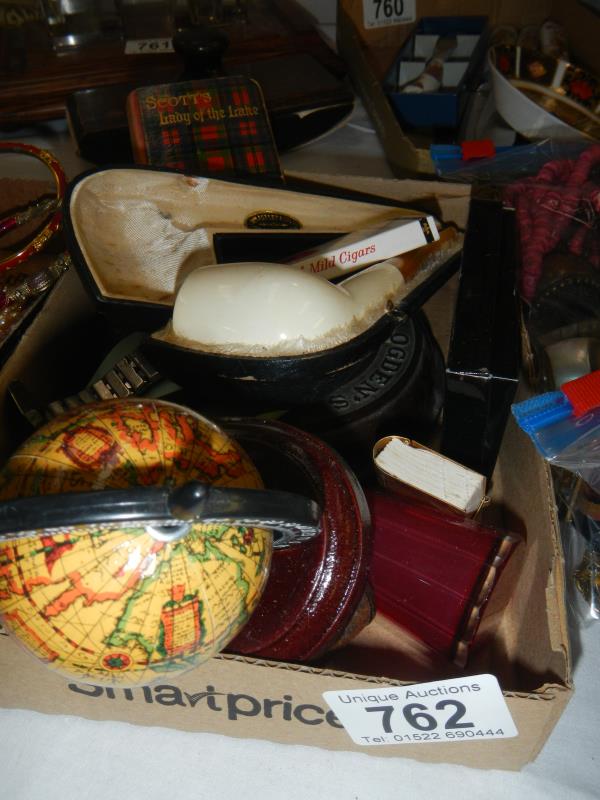 A box of miscellaneous items including pipe etc