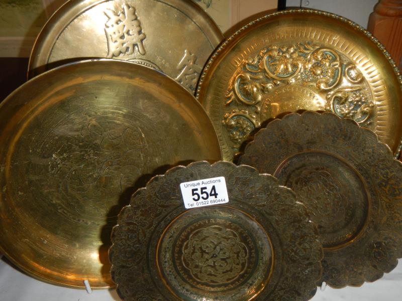 5 brass bowls and plates including a Chinese example and a brass fork