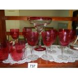 A quantity of cranberry coloured glassware