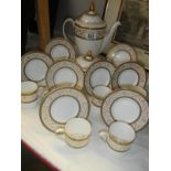 A Minton Aragon coffee set comprising 10 cups with saucers,