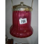 A cranberry lidded biscuit barrel