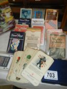 A collection of vintage cards and playing cards
