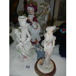 3 figurines and a figural china candlestick