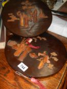 Two Japanese round wooden plaques