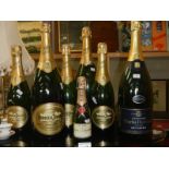 8 empty bottles of champagne including Moet and Chandon (although bottles appear sealed)