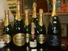 8 empty bottles of champagne including Moet and Chandon (although bottles appear sealed)