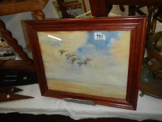 A framed and glazed picture of Ducks in Flight