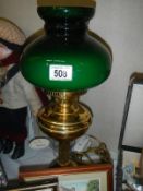 An oil map style electric light with green shade