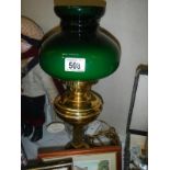 An oil map style electric light with green shade