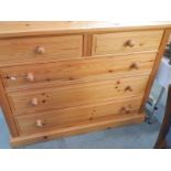 A 2 over 3 pine chest of drawers