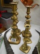 A quantity of 5 brass candlesticks