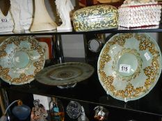 A pair of green glass with gilding plates and a green glass with gilding footed plate