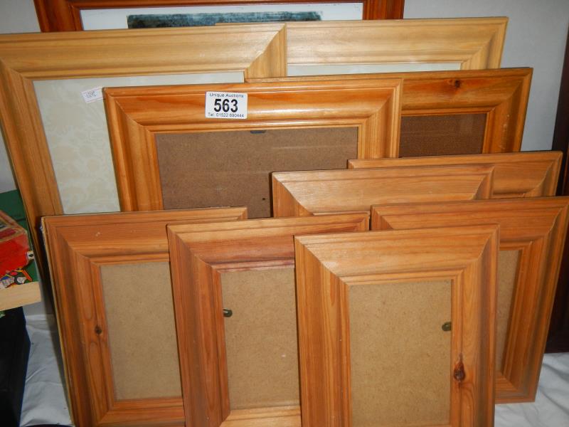 Approximately 14 wooden picture frames