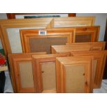 Approximately 14 wooden picture frames