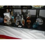 A collection of perfumes and bottles including full bottle of Vera Wang